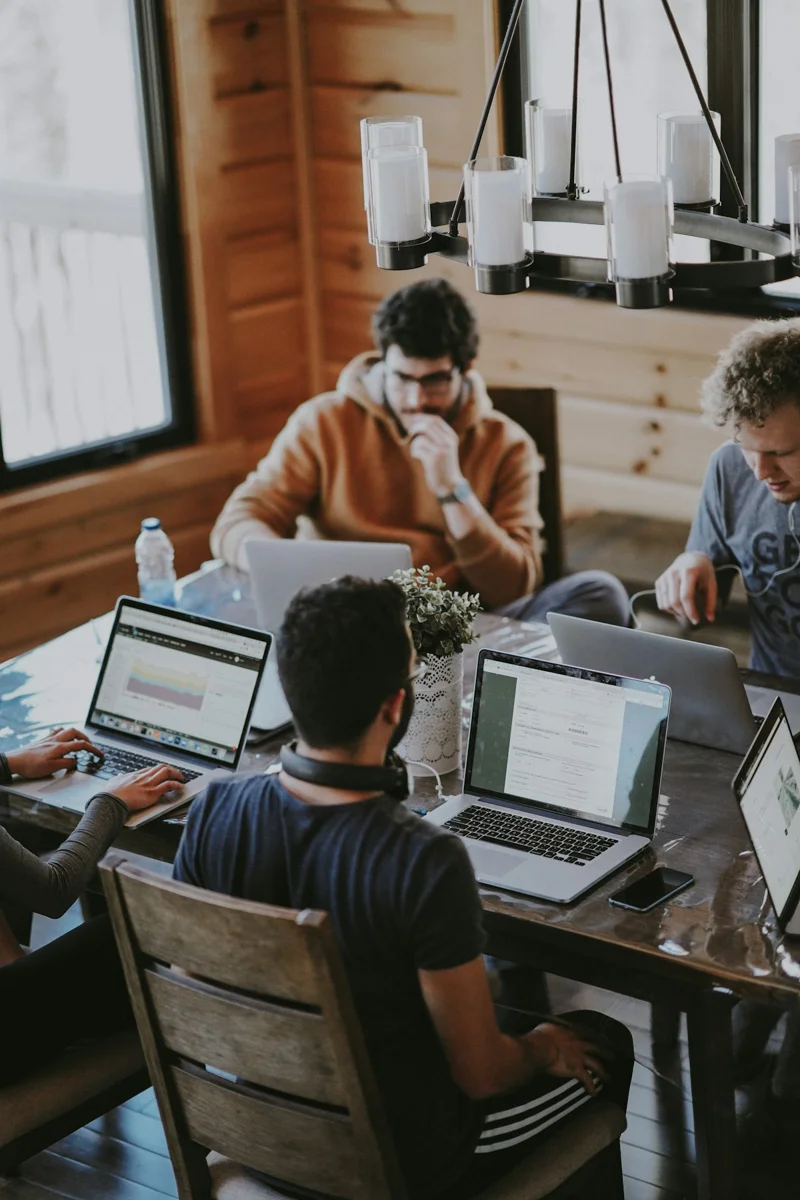 People collaborating around a table in a creative workspace