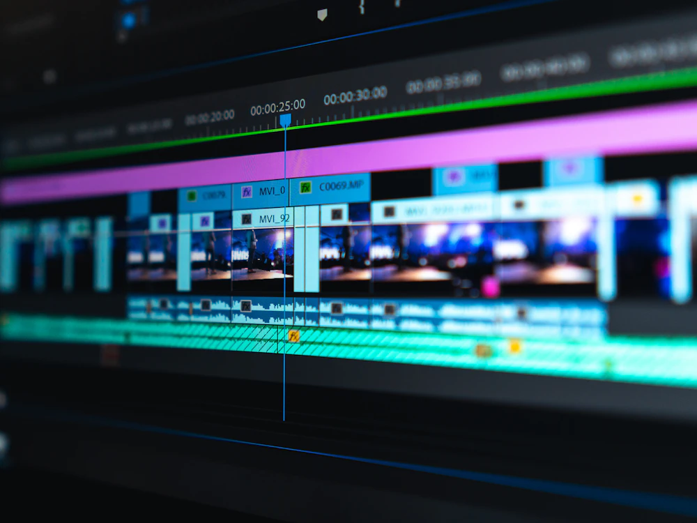 Video editing timeline and preview frames displayed on a monitor